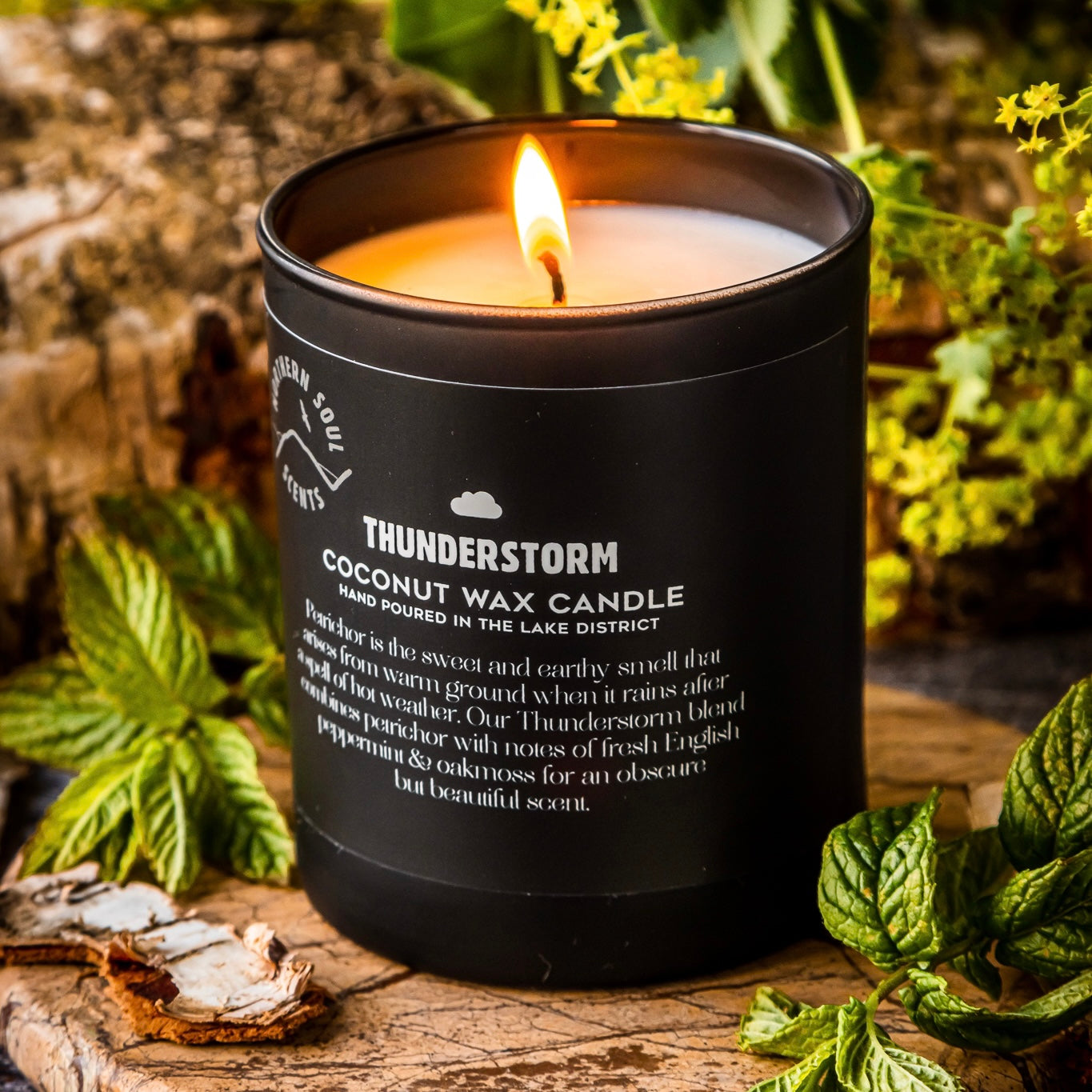  Indulge in the captivating scent of petrichor with this premium scented candle. Housed in a sleek matte black jar, adorned with a charming cloud and umbrella design on the label, experience the refreshing aroma of rain-kissed earth, accompanied by the subtle rumble of distant thunder. Elevate your space with this exquisite combination of fragrance and aesthetics."