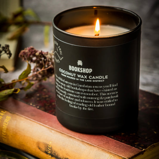 "Matte Black Jar Bookshop Scented Candle: Embrace the ambiance of a charming bookshop with this exquisite scented candle. Encased in a sleek matte black jar, enjoy the inviting aroma of well-worn books, cedarwood shelves, creating a cozy and literary atmosphere."