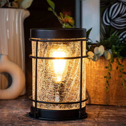 Industrial-Style Electric Wax Melt Warmer: Enhance your space with this striking electric wax melt warmer featuring an industrial design. The crackle glass and Edison bulb combine to create a captivating visual effect. Simply place your favorite wax melts in the dish and enjoy the aromatic ambiance. The warm glow from the Edison bulb adds a touch of vintage charm.