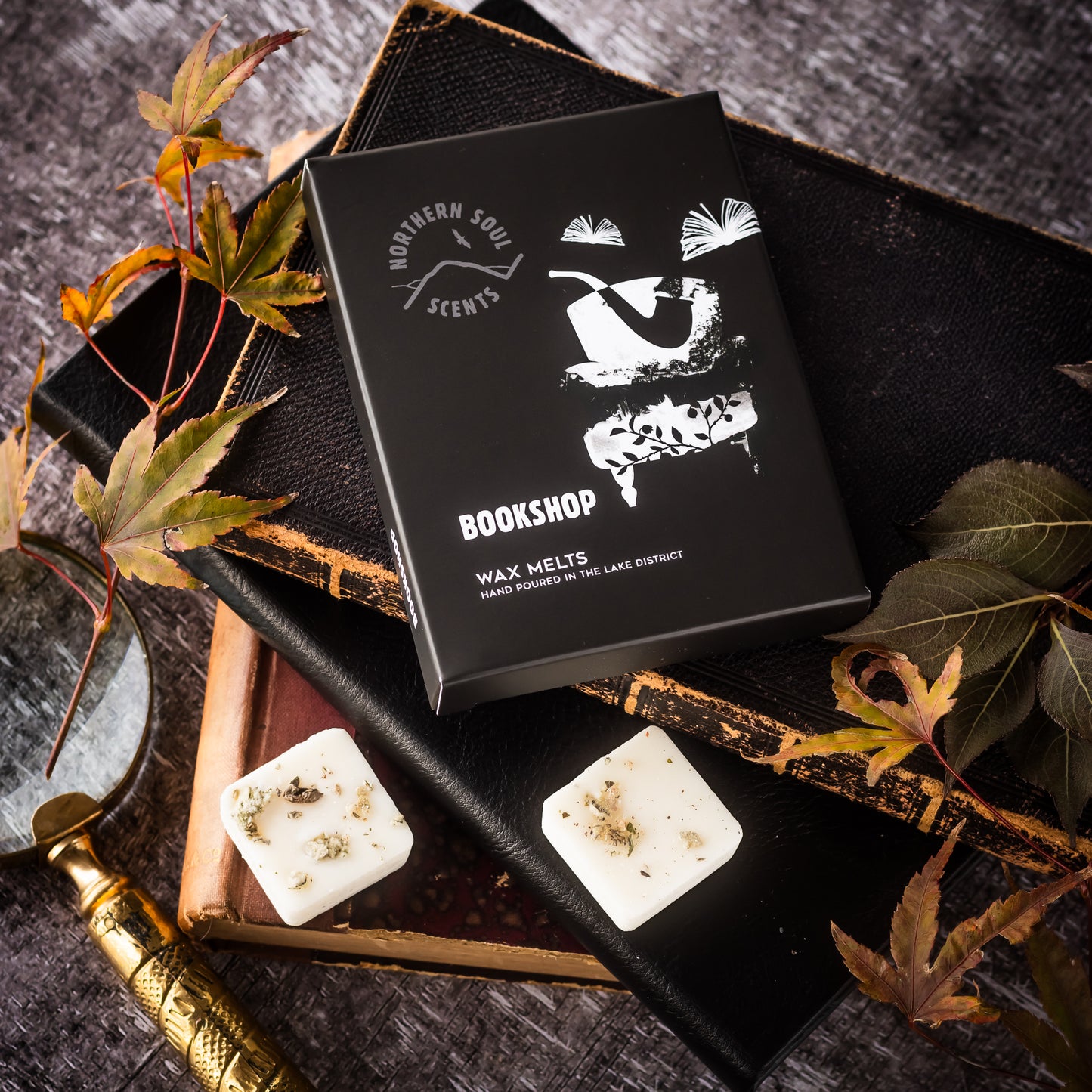 Delight in the nostalgic charm of a bookshop with these eco-friendly wax melts. Encased in a plastic-free wax paper bag and adorned with a cardboard sleeve featuring a quirky book and armchair design on the front, experience the captivating aroma of well-loved books, cozy armchairs, and a hint of vanilla. Immerse yourself in the inviting ambiance of your favorite reading nook with these delightful wax melts.